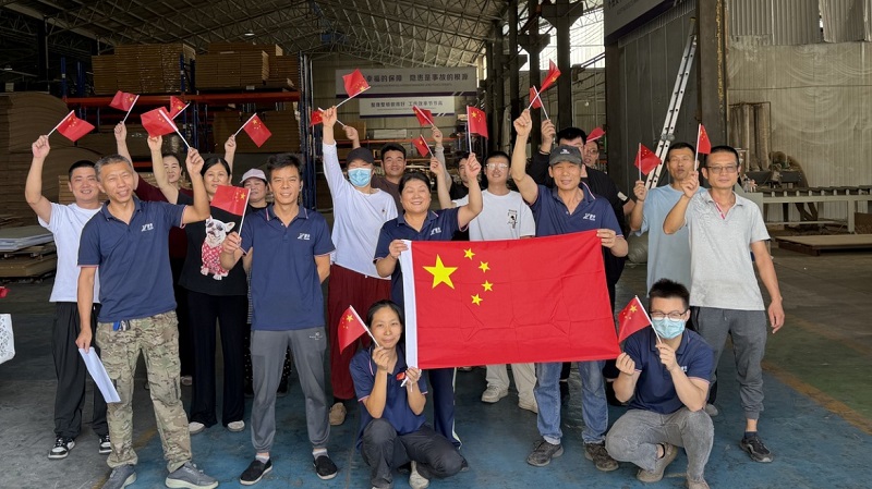 Production colleagues gathered inside the workshop for a group photo
